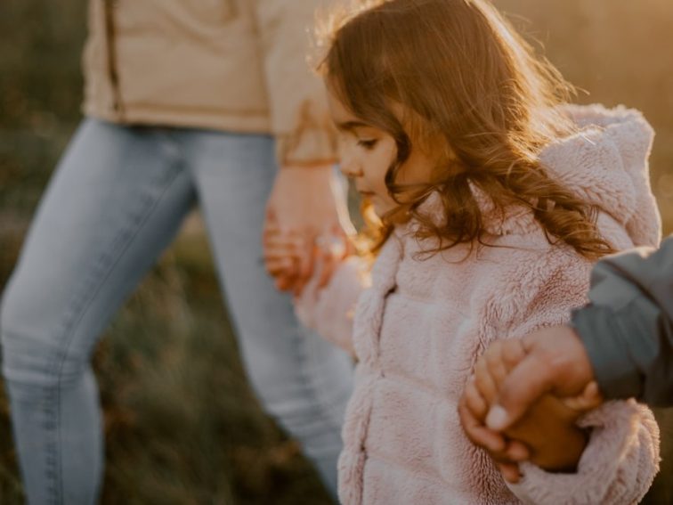 a person holding a child